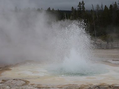 Yellowstone National Park geyser bubbles to eruption
