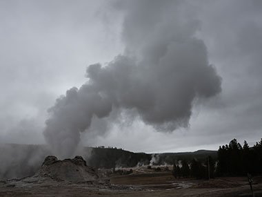 Steam flows away from geyser