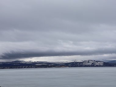 Clouds over frozen lake in Yellowstone National Park