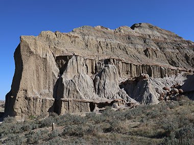 sun draped Theodore Roosevelt National Park cliff