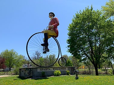 World's Largest Bicyclist with blue sky beyond