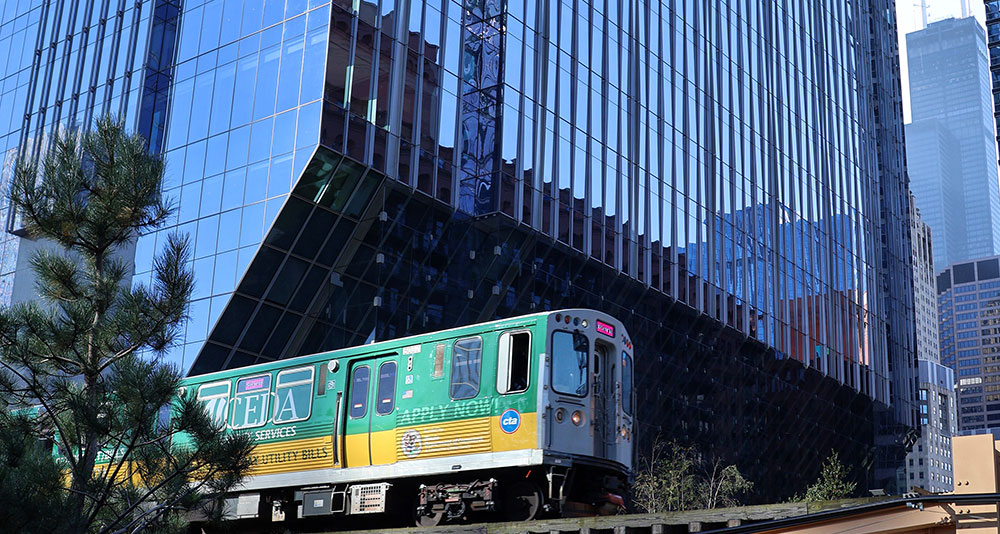 Elevated train passes buildings in Chicago