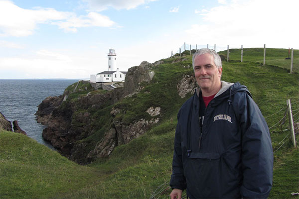 Pat with lighthouse in background