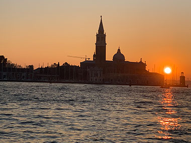 Sunset behind church on an island