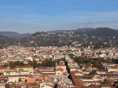 Florence from dome on clear day with only a few clouds in the distance