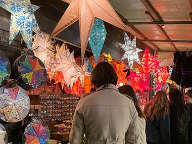 People looking at ornaments at Christmas Market