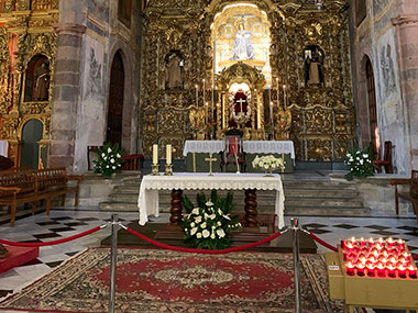 Candles in front of altar of church