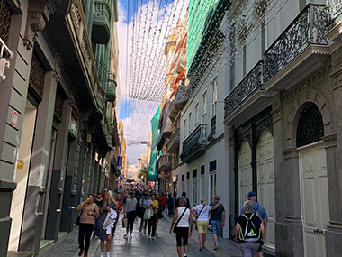 People walking down car free street