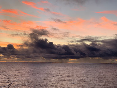 Low clouds beyond boat