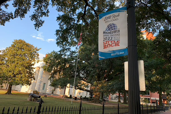 High Ed Web Conference welcome sign on lamp post