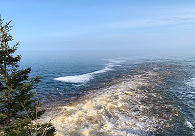 Cascade River flows into lake in early evening