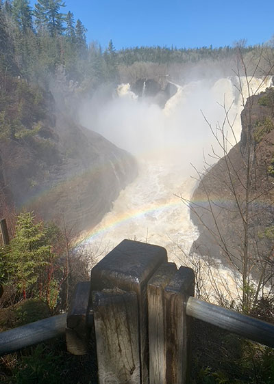 Rainbow in front of waterfall