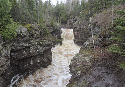 Cliffs rise above river