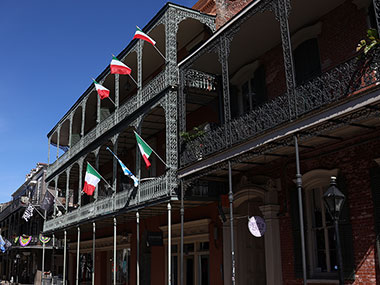 Irish flags hang on balcony