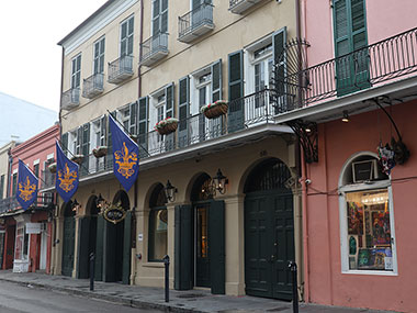 Flags hang from second floor balcony