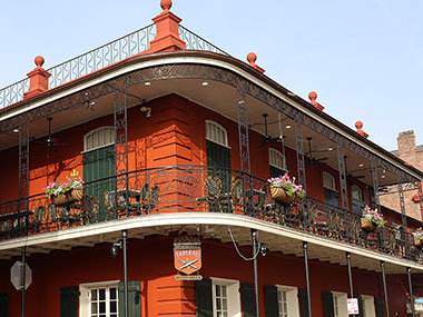 Red building with white balcony