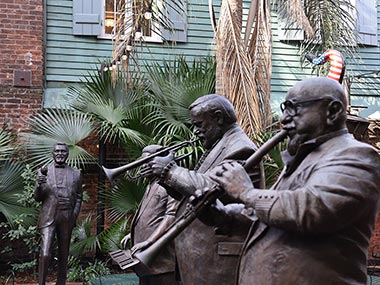 Four statues of musicians