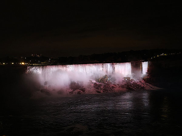 White light shines on Niagara Falls as viewed from Canadian side