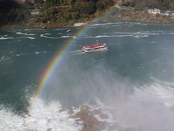 Rainbow with boat in background