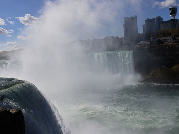 Mist rises above the falls