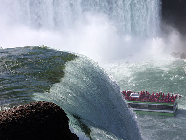 Boat moves past falls