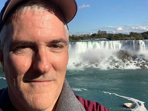 Closeup of Pat with waterfall behind