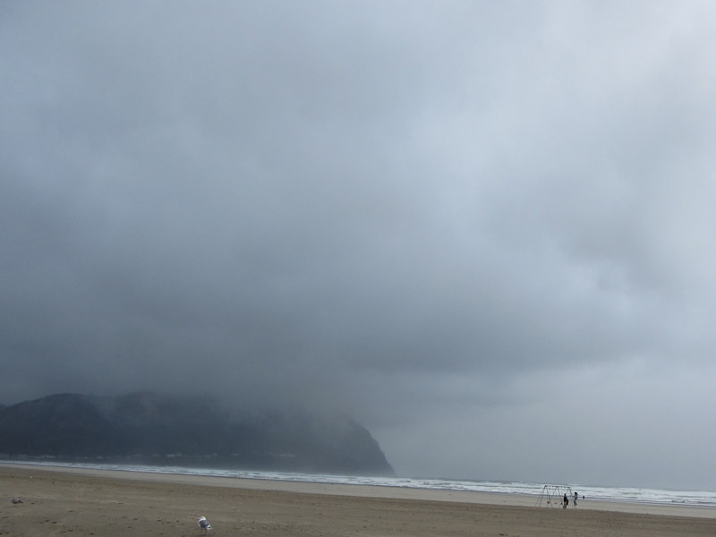 Storm over the ocean looking toward a cliff