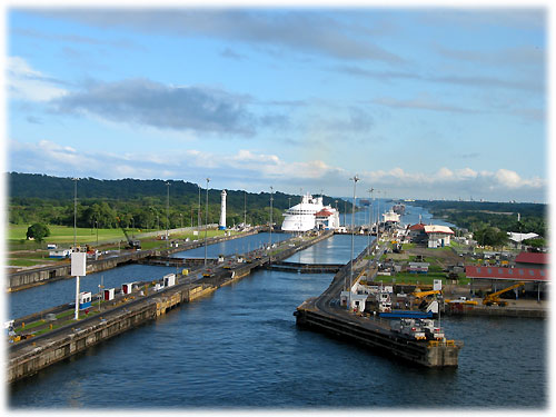 Ships pulling into locks of Panama Canal