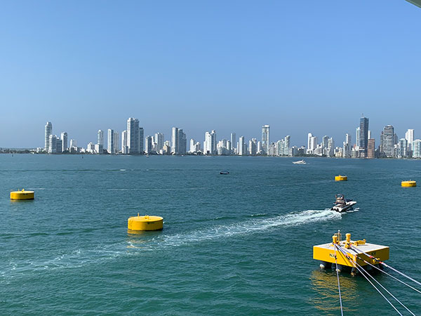 Colombia skyline beyond water from ship
