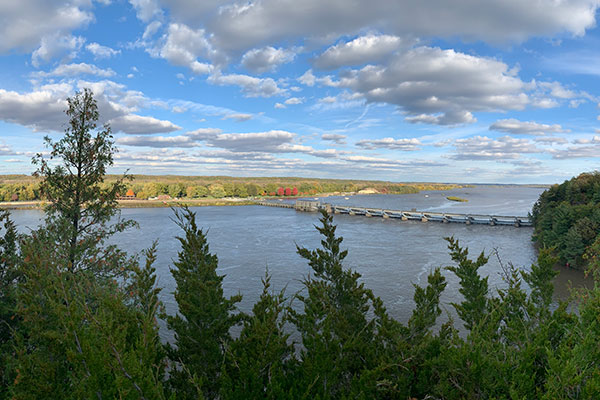 Clouds over river and dam