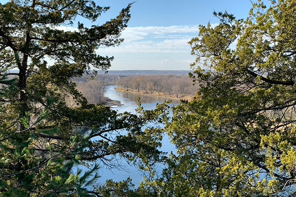 River in distance beyond trees