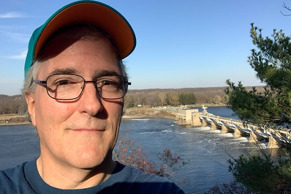 Pat with Dam in background