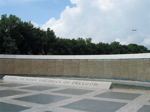 Plane flys over World War Two Memorial